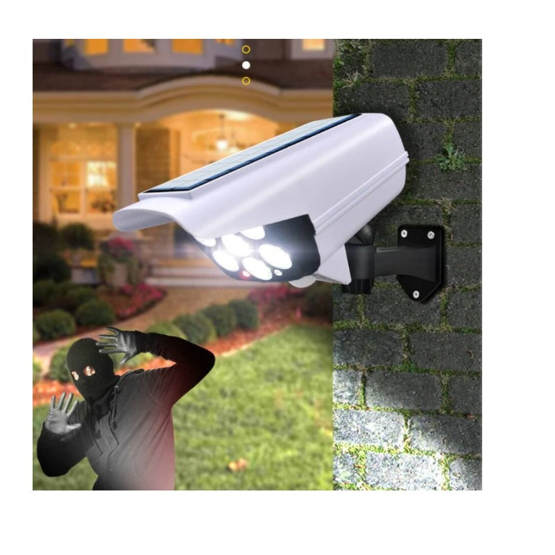 Lampă Solară Exterior cu Senzor de Mișcare, Telecomandă și 77 LED-uri – Model Cameră Supraveghere, IP65